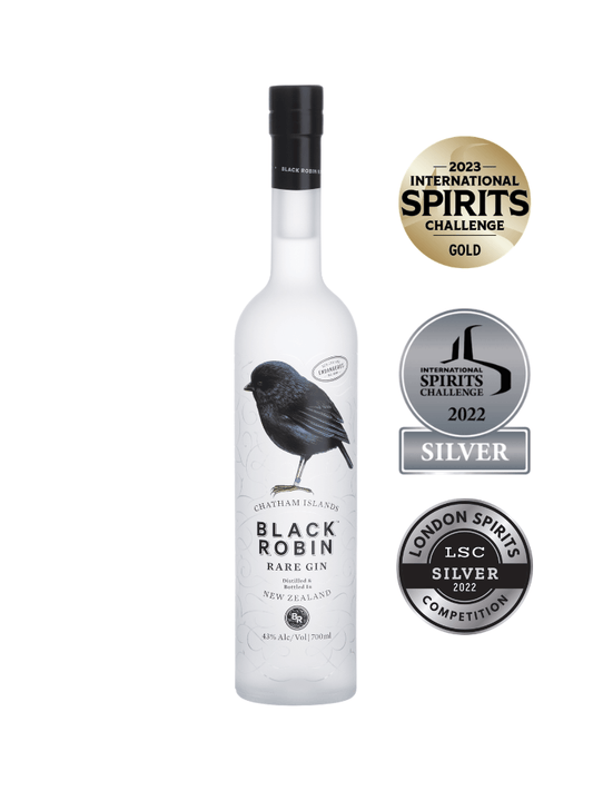 A bottle of Black Robin Rare Gin on a white background, flanked by three award seals: 2023 International Spirits Challenge Gold, 2022 International Spirits Challenge Silver, and London Spirits Competition Silver.